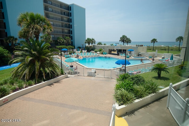 view of swimming pool with a patio area