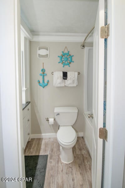 full bathroom featuring shower / washtub combination, toilet, vanity, and wood-type flooring