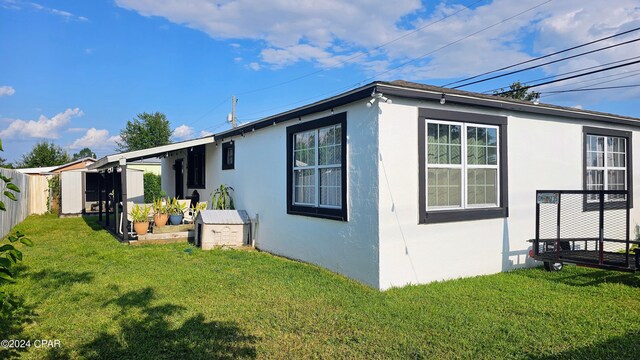 exterior space featuring a lawn