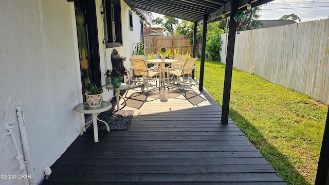 wooden deck with a yard