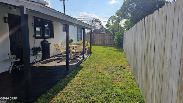 view of yard featuring a wooden deck