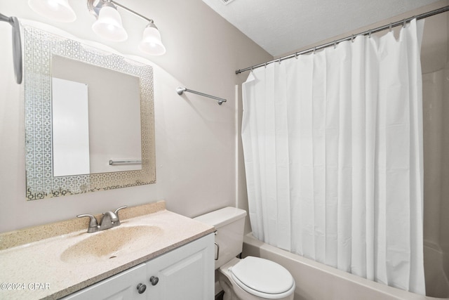 full bathroom with vanity, shower / bath combo with shower curtain, toilet, and a textured ceiling