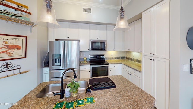 kitchen featuring appliances with stainless steel finishes, tasteful backsplash, and light stone counters