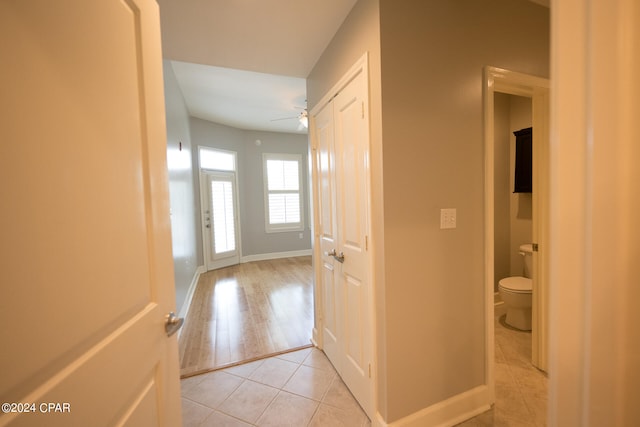 corridor with light hardwood / wood-style flooring