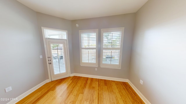 empty room with light wood-type flooring