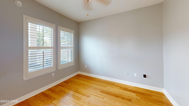 unfurnished room with ceiling fan and light hardwood / wood-style floors