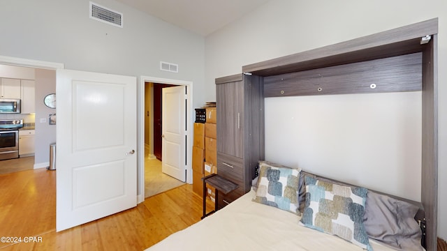 tiled bedroom featuring lofted ceiling