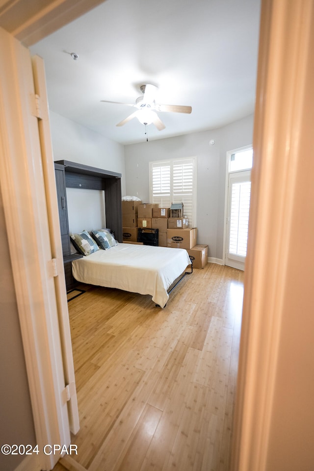 unfurnished bedroom featuring light hardwood / wood-style flooring and ceiling fan