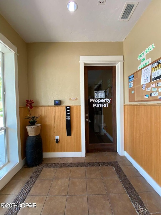 interior space featuring dark tile patterned flooring