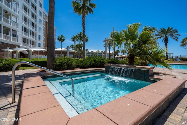 view of pool with pool water feature