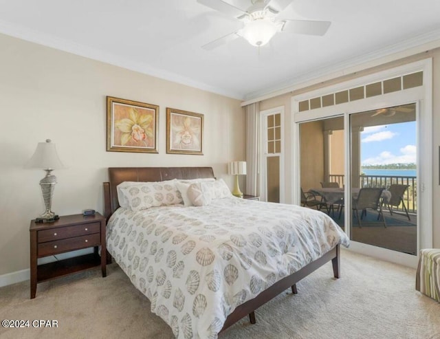 carpeted bedroom featuring ceiling fan, access to exterior, a water view, and ornamental molding