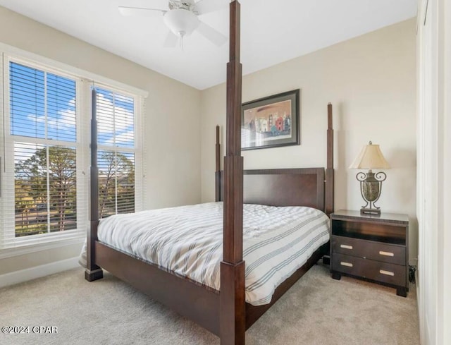 bedroom featuring ceiling fan and light colored carpet