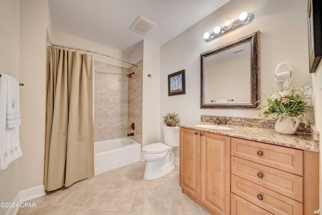 full bathroom with tile patterned floors, vanity, shower / tub combo with curtain, and toilet