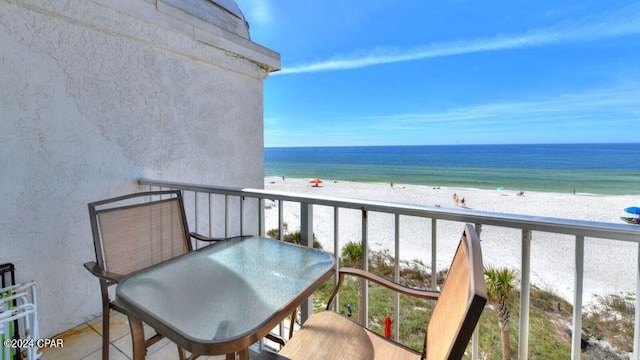 balcony with a beach view and a water view