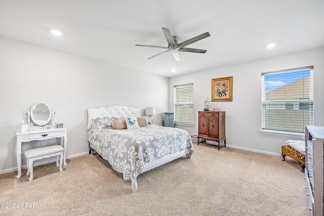 carpeted bedroom featuring ceiling fan