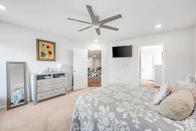 carpeted bedroom featuring ceiling fan