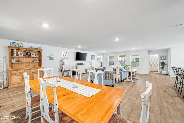 dining space featuring light hardwood / wood-style flooring