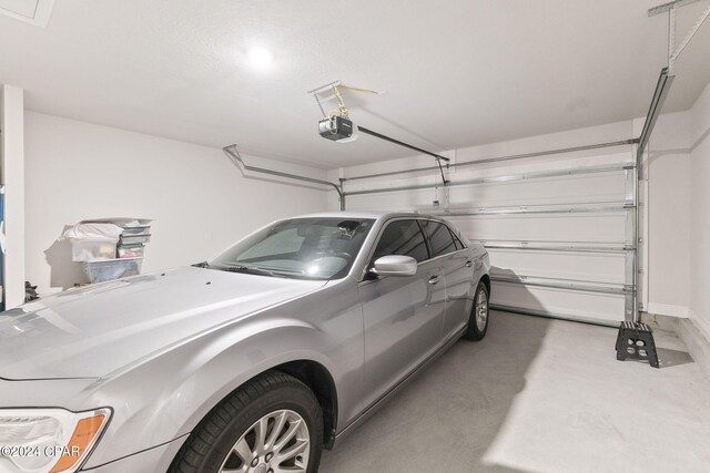 garage featuring a garage door opener