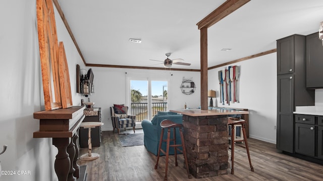 kitchen featuring ceiling fan, crown molding, dark hardwood / wood-style flooring, and gray cabinetry