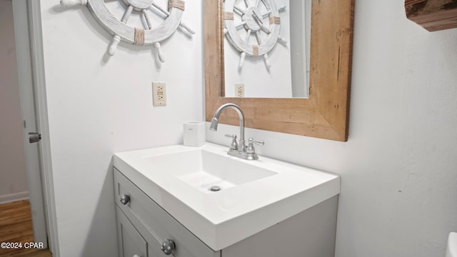 bathroom featuring hardwood / wood-style floors and vanity