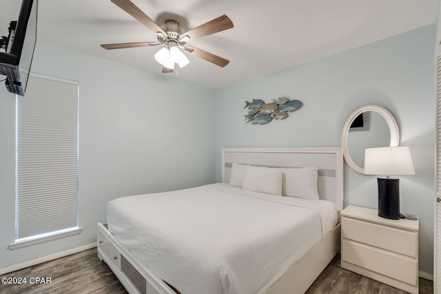 bedroom featuring ceiling fan and wood finished floors