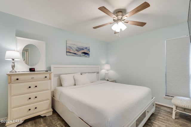 bedroom with dark wood-style floors and a ceiling fan