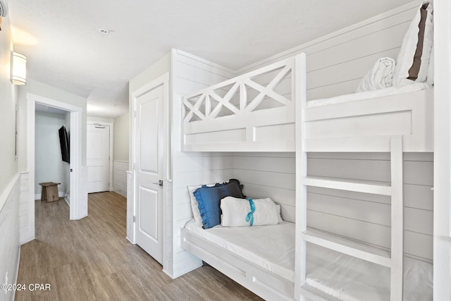 mudroom with a textured ceiling and hardwood / wood-style floors