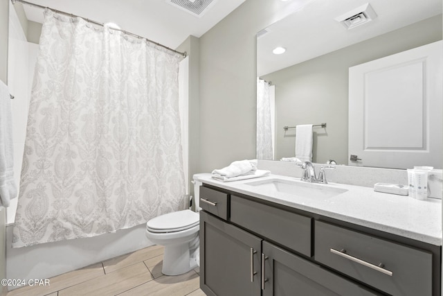 full bathroom with vanity, toilet, wood-type flooring, and shower / bathtub combination with curtain