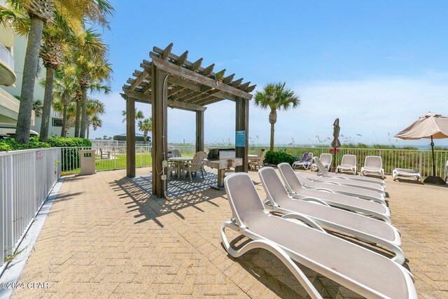view of patio / terrace with a pergola and outdoor dining area