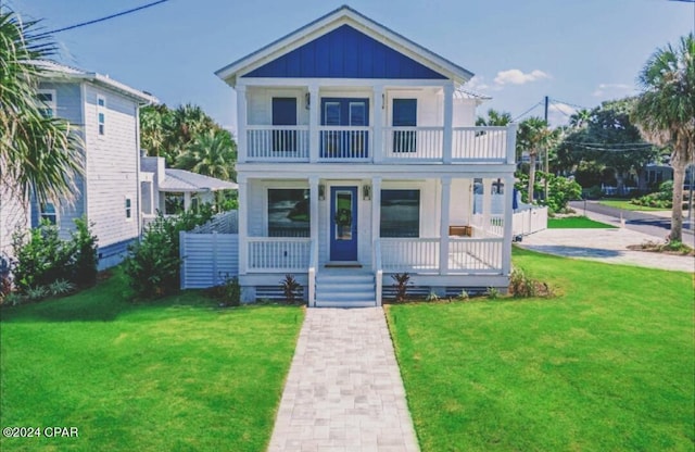 view of front of house with a front lawn and covered porch