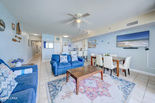 living room with visible vents, ceiling fan, light tile patterned flooring, and track lighting