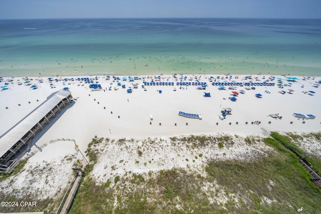 birds eye view of property featuring a view of the beach and a water view