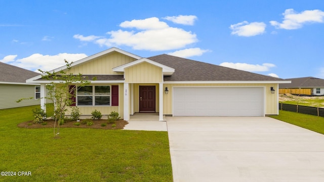 single story home featuring a garage and a front lawn