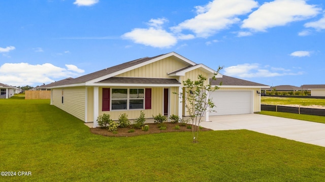 view of front facade with a garage and a front lawn