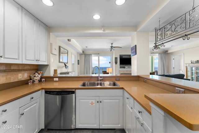 kitchen featuring ceiling fan, white cabinets, sink, kitchen peninsula, and stainless steel dishwasher