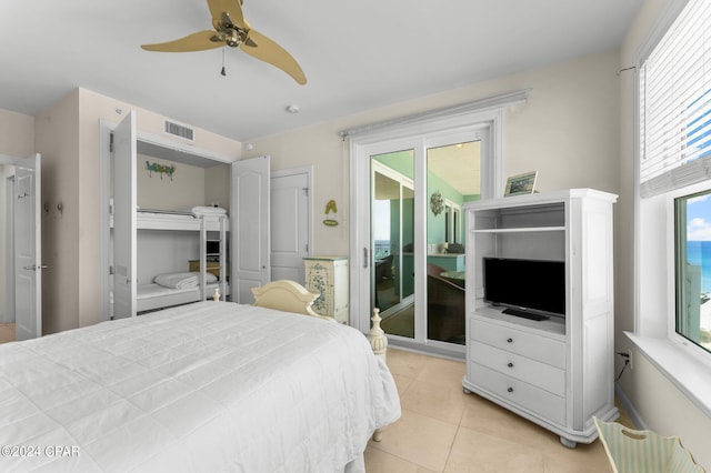 tiled bedroom featuring ceiling fan and access to outside