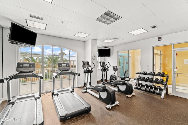 workout area featuring a drop ceiling