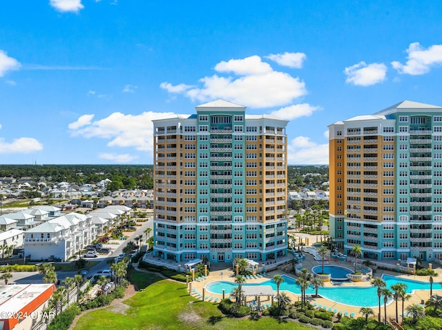 view of building exterior with a community pool