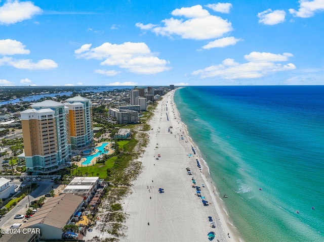 bird's eye view featuring a water view and a beach view