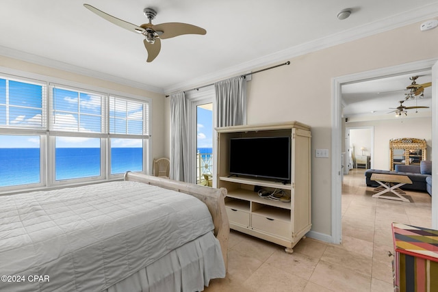 tiled bedroom with ornamental molding and ceiling fan