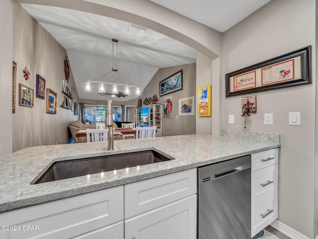 kitchen featuring stainless steel dishwasher, white cabinetry, light stone countertops, and vaulted ceiling