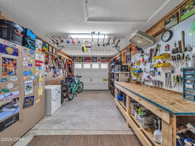 garage with a workshop area and washer / dryer