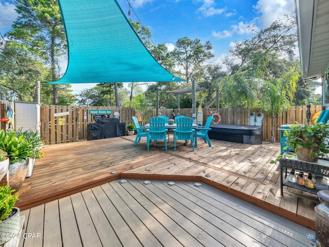 deck featuring a hot tub