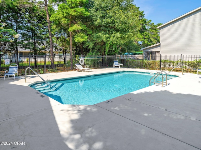 view of swimming pool featuring a patio