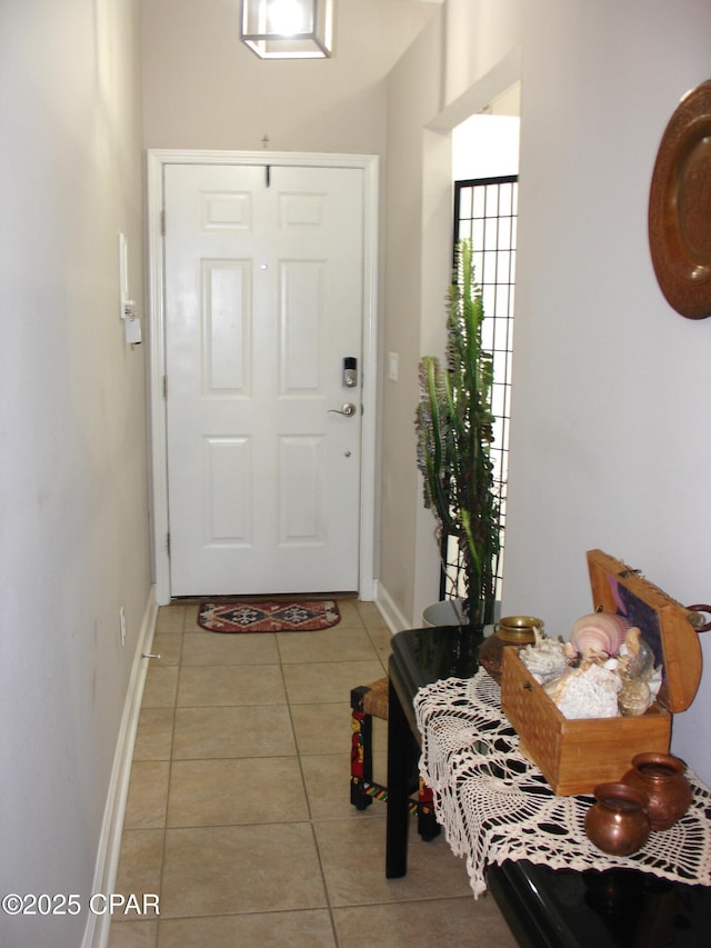 foyer entrance featuring light tile patterned floors