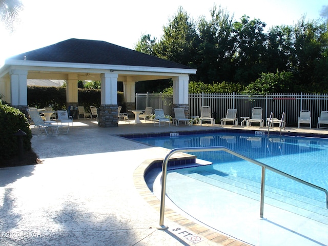 view of swimming pool with a gazebo and a patio