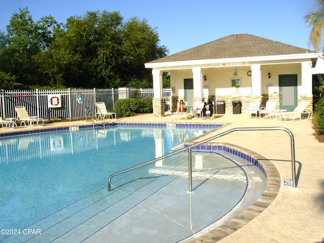 view of pool featuring a patio