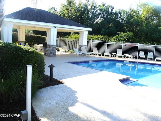 view of swimming pool featuring a gazebo and a patio