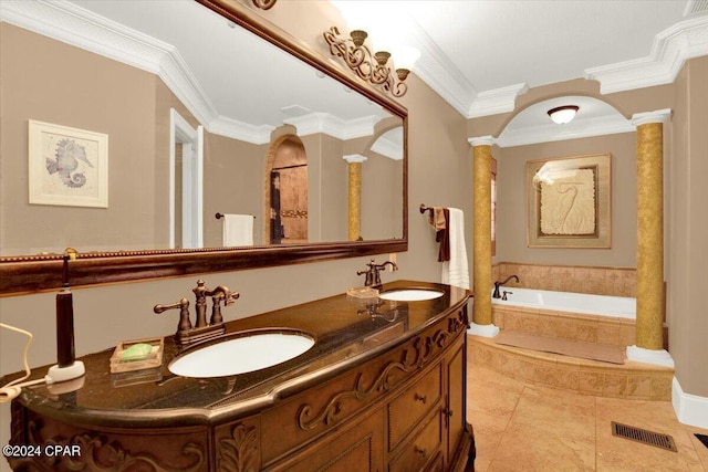 bathroom featuring tile patterned flooring, double vanity, ornate columns, a relaxing tiled tub, and crown molding