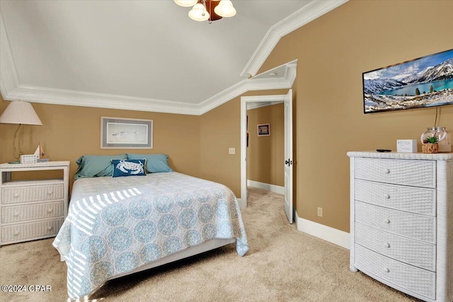 bedroom with crown molding, light colored carpet, and lofted ceiling